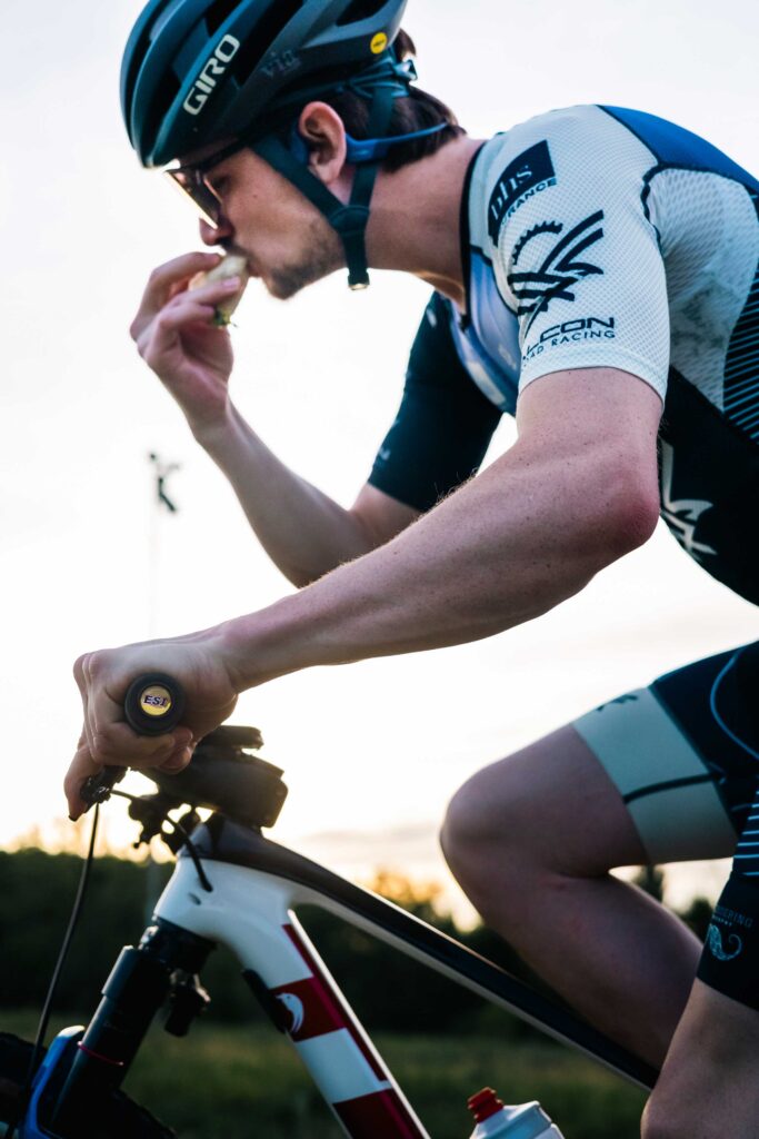 Mountain biker riding while eating a taco