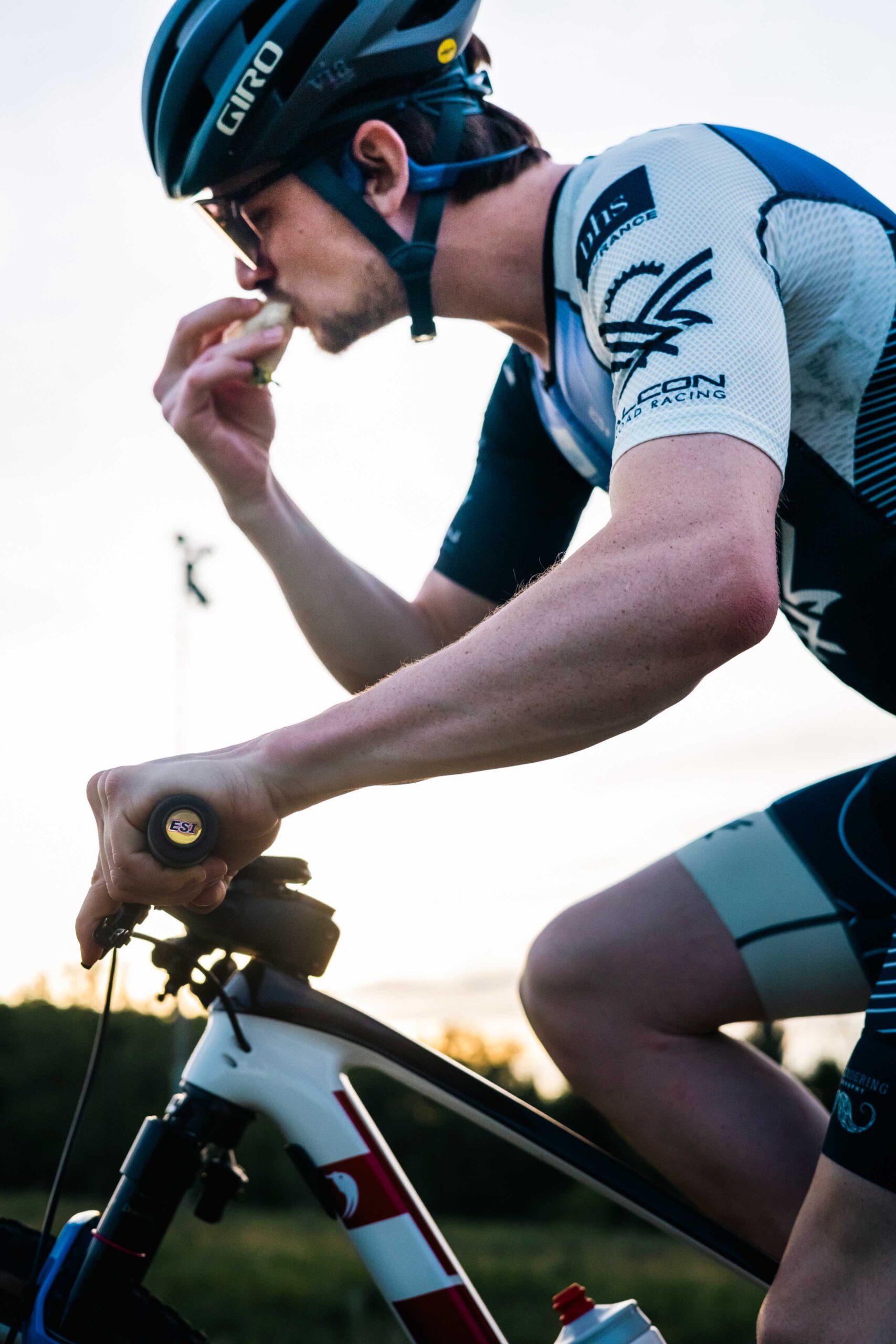 Mountain biker riding while eating a taco